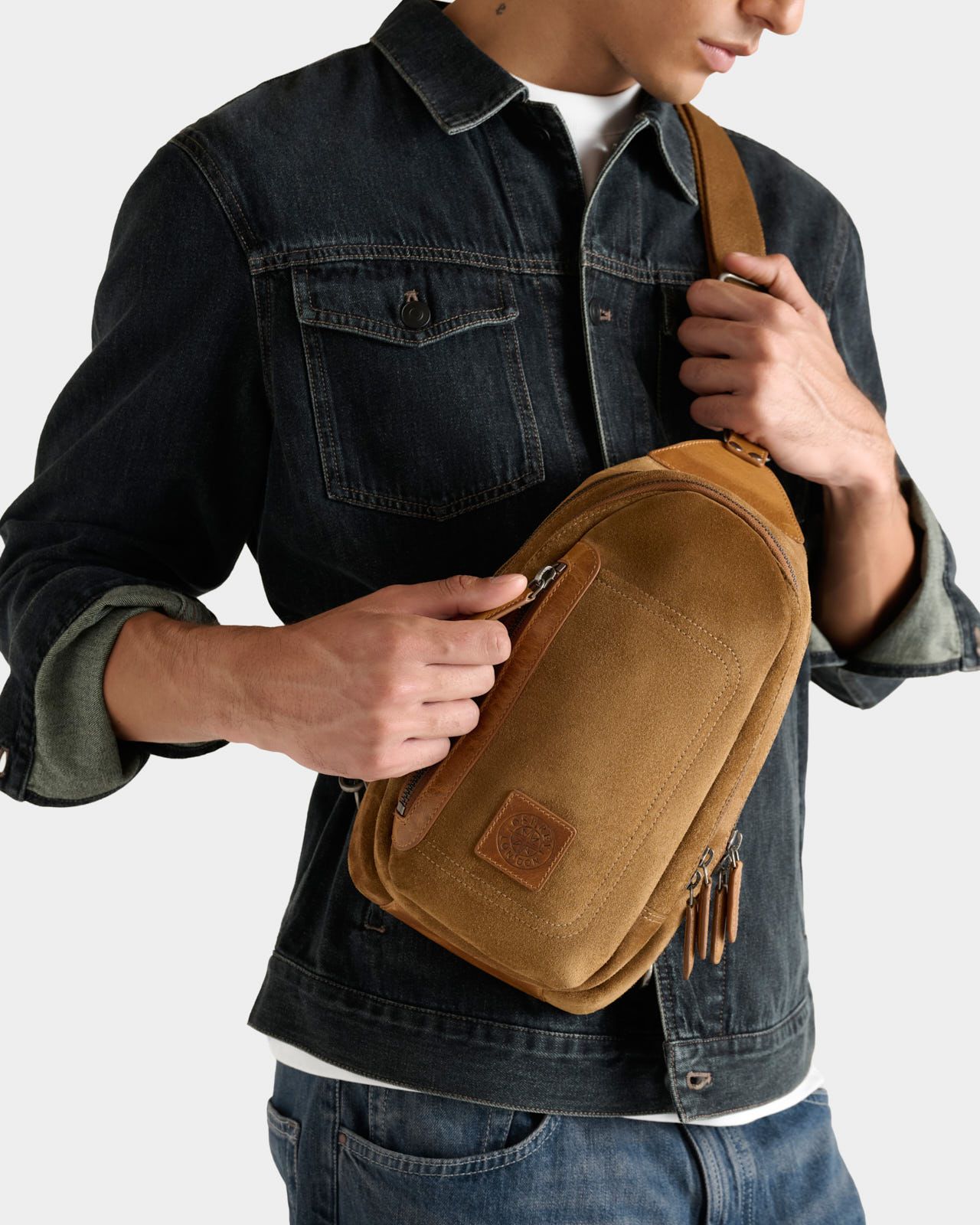 Image number 1 of The Heritage Suede Sling Bag in Tan